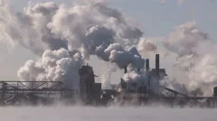 Smoke stacks from industry belching carbon and gases into the environment