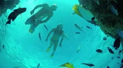 UNDERWATER: Couple on romantic honeymoon snorkeling tropical reef