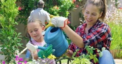 Mother and daughter gardening together