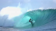 SLOW MOTION: Extreme surfer surfing inside big tube barrel wave