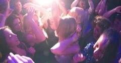 Women and Girls dancing and cheering in club during party