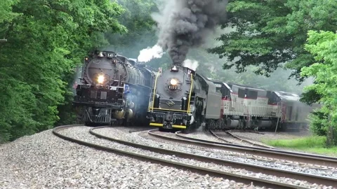 06/14/26: Two steam engines from early 20th century climb a steep grade in PA Stock Footage 336932364