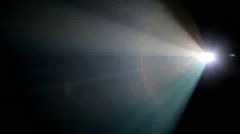 Light beam of a 35mm projector running in a darkened movie theater