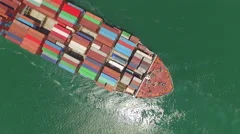 AERIAL: Huge container ship fully loaded with cargo shipping goods