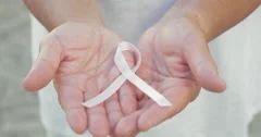 Open Hands Holding Breast Cancer Awareness Ribbon