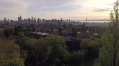 Amazing Aerial of Seattle Washington Flying by Trees to Reveal Downtown City