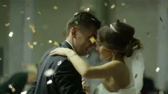 Beautiful brunette bride and handsome groom dancing first dance at the wedding