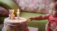 Birthday cake, Baby and mother celebrate first birthday holiday