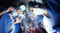 4K Surgeons anesthetizing patient in operating theater before surgery