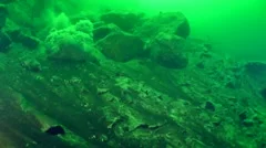 Underwater avalanche on a rocky slope.