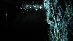 Slow Motion Glass Shattering From Right-To-Left Over Black Background in 4k
