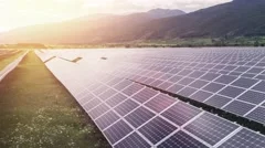 Solar Panels Farm Green Energy Aerial Flight At Sunset Orange Colors Mountains