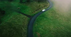Aerial view electric car driving on country road