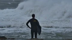 NSW, AUSTRALIA - JUNE 2016: bodyboarder surfer storm sea swells white wash