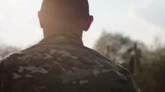 Army soldier walking confident in sunset scene