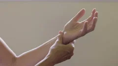 Woman with arthritis in hand and wrist, close up