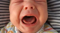 Mouth of crying newborn baby, audio, close-up
