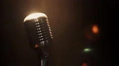 View of concert vintage microphone stay on stage under bright spotlight. Smoke