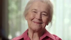 Close up of an elderly senior female woman smiling