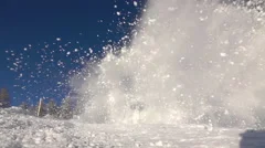 SLOW MOTION: Big snow avalanche sliding down a mountainside and into camera