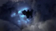 flying through stormy clouds lit with lightning bolt flash