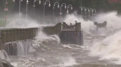 Huge powerful waves breaking at seawall in major severe storm