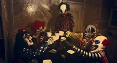 Clowns drinking tea. Horror Halloween.