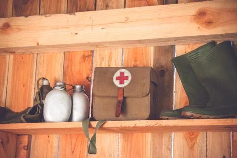 Retro  medic  equipment  on  an  old  wooden  shelfe  with  boots  and  water  bottles xkwx accident,  aid,  ambulance,  army,  background,  bag,  boots,  care,  combat,  cross,  detail,  doctor,  emergency,  equipment,  fabric,  first,  grunge,  health,  healthcare,  help,  hospital,  hurt,  injury,  insurance,  jute,  kit,  medic,  medical,  medicine,  military,  object,  old,  pharmacy,  red,  rescue,  retro,  rustic,  safety,  shelfe,  supplies,  symbol,  texture,  travel,  treatment,  vintage,  war,  water,  weathered,  white,  wood