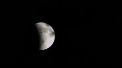 Time lapse - lunar eclipse partially covering moon moving