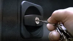 The man opens the safe key