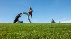 Temperamental Golfer Throwing a Tantrum on the Golf Course