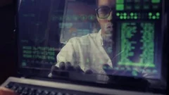 double exposure shot of man hacker working at a laptop