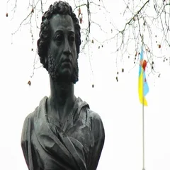 Alexander Pushkin monument and fluttering flag of Ukraine in Odessa, ua
