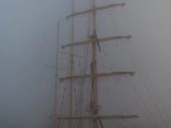 Ship with flags in the fog early morning. Regatta competition.Video.