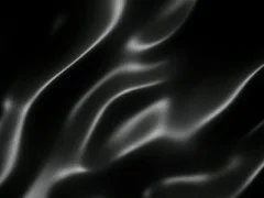 Black wavy fabric motion background seamless loop