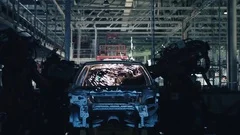 Car Factory. Robotic Arm Making Car In Line