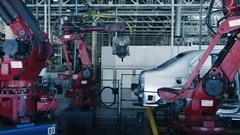 Car Factory. Robotic Arm Making Car In Line