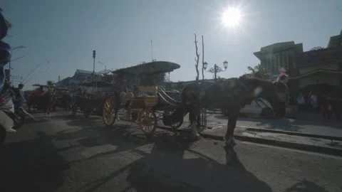 07 April 2018. Yogyakarta IDN - Horse Drawn Carriage On City Street During .. Stock Footage 301772653
