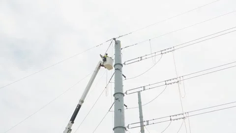 07-June-2026 Georgetown, TX linemen working on power pole from bucket lift Stock Footage 336618487