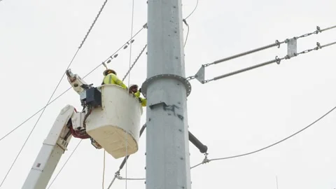07-June-2026 Georgetown, TX linemen working on power pole from bucket lift Stock Footage 336618588