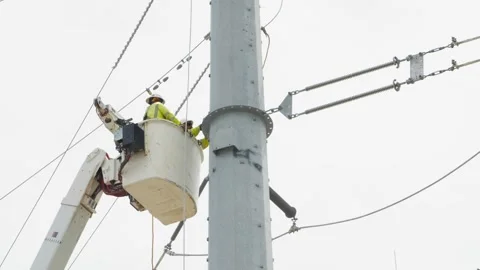 07-June-2026 Georgetown, TX linemen working on power pole from bucket lift Stock Footage 336618612