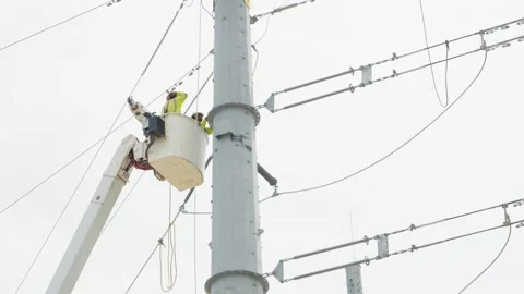 07-June-2026 Georgetown, TX linemen working on power pole from bucket lift Stock Footage 336618638