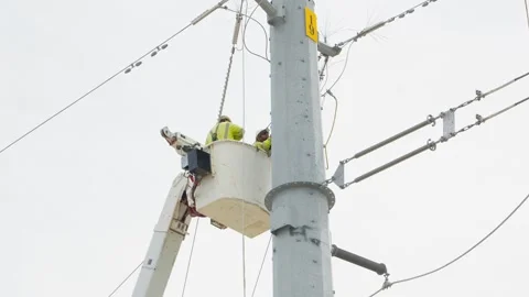 07-June-2026 Georgetown, TX linemen working on power pole from bucket lift Stock Footage 336618739