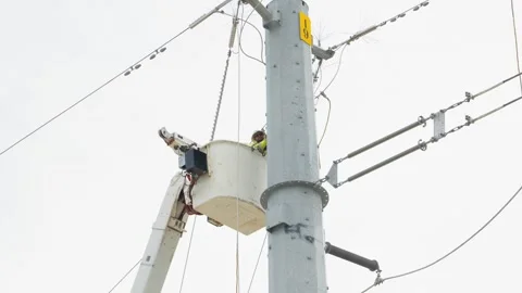 07-June-2026 Georgetown, TX linemen working on power pole from bucket lift Stock Footage 336618820