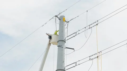 07-June-2026 Georgetown, TX linemen working on power pole from bucket lift Stock Footage 336619293