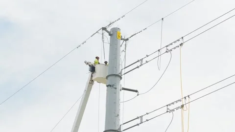 07-June-2026 Georgetown, TX - linemen working on power pole from bucket lift Stock Footage 336619355