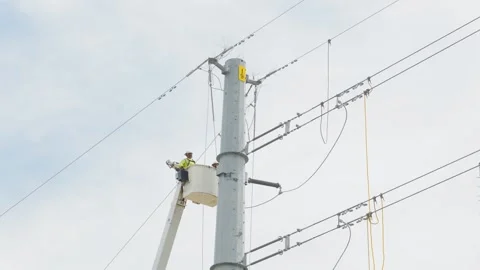 07-June-2026 Georgetown, TX - linemen working on power pole from bucket lift Stock Footage 336619443