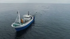 Flying over a Commercial Fishing Ship that Pulls Trawl Net