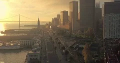Aerial of San Francisco Ferry Building, bay bridge, Embarcadero & city at