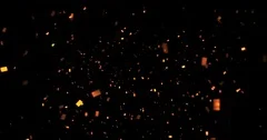 falling gold sparkle glitter foil confetti, animation on black background